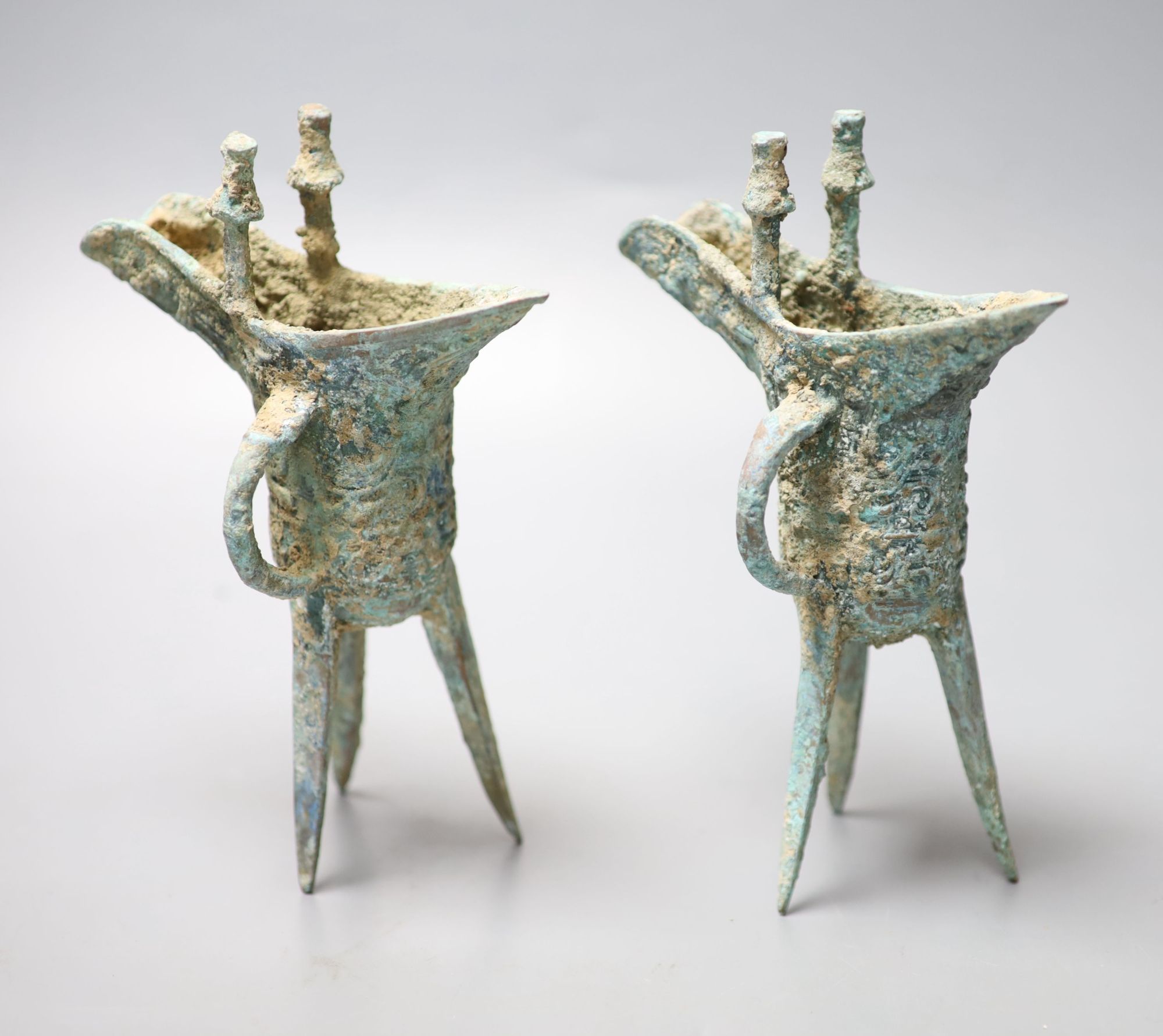 Two Chinese bronze archaistic tripod vessels, height 19cm